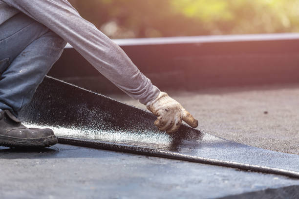 Professional Basement Waterproofing technician working in Parkville, MD
